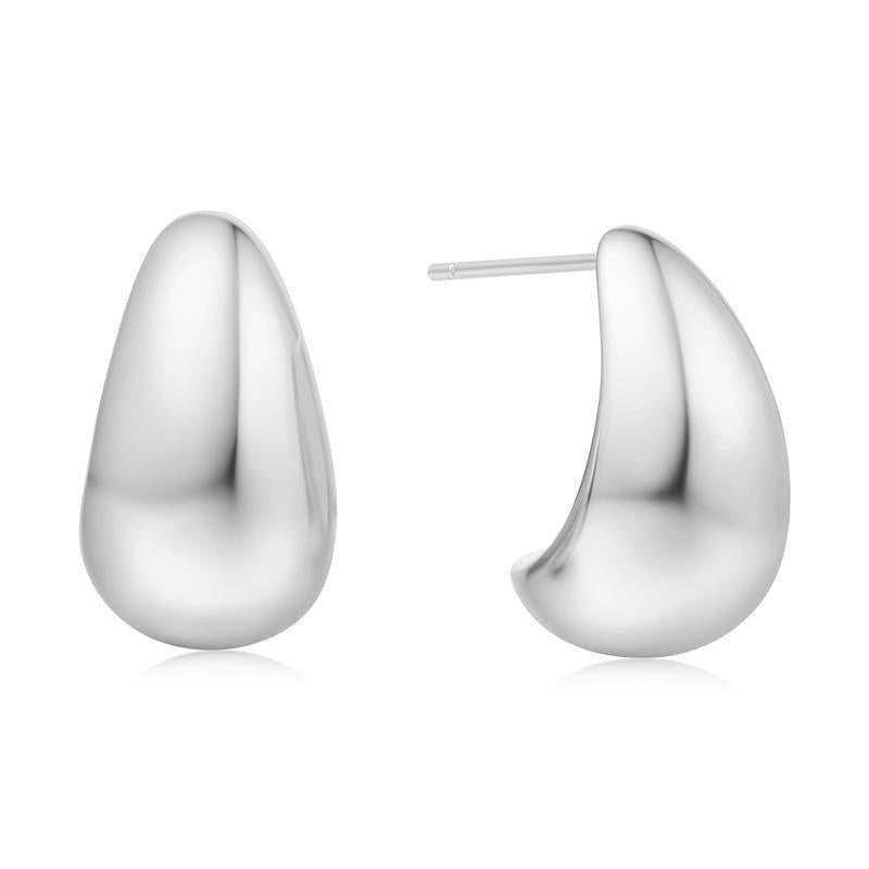 Ania Haie bold dome hoop earrings in polished 925 sterling silver with a sleek, minimalist teardrop design.
