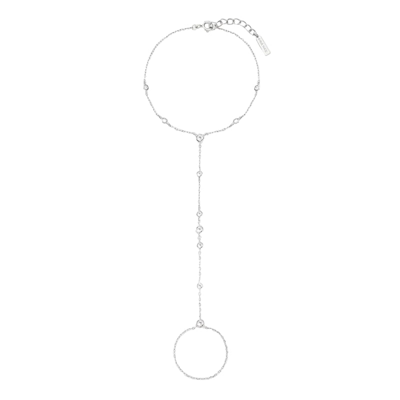 A delicate silver lariat-style chain necklace with a large textured circular pendant at the bottom, displayed on a clean white background.