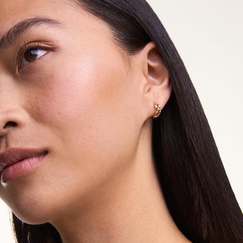Elegant 13.6mm rose gold 3-link hoop earrings crafted from PVD plated stainless steel worn on a model.