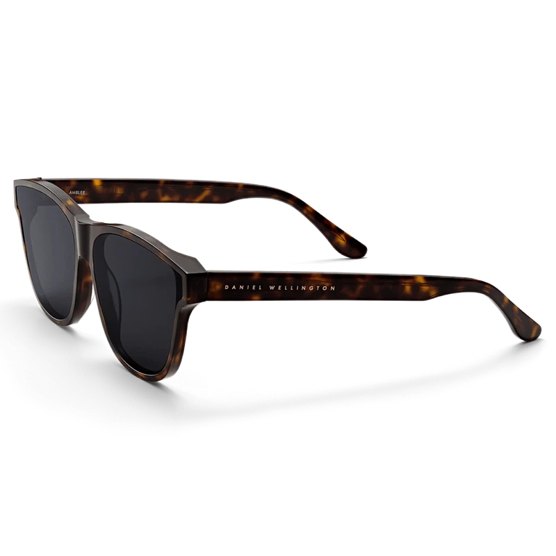 Daniel Wellington Ambler sunglasses in dark havana bio-acetate with sleek black lenses and a modern classic frame design.