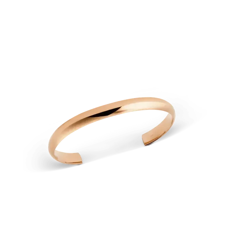 Minimalist Daniel Wellington Arch cuff in polished rose gold with a smooth, rounded 6 mm profile.