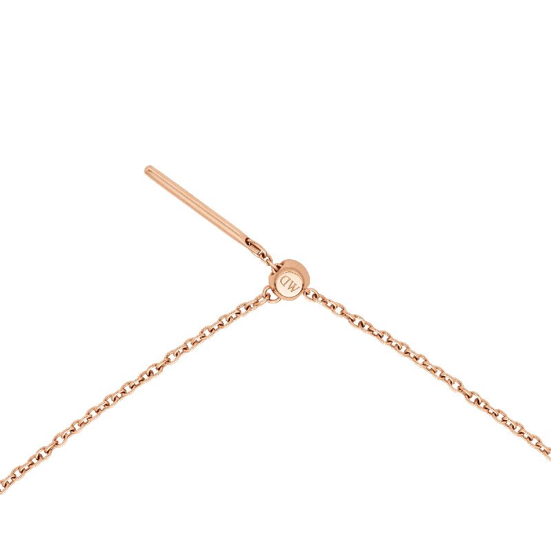 Elegant rose gold plated stainless steel Daniel Wellington charms chain necklace with an adjustable sliding clasp.