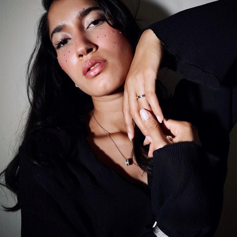Daniel Wellington Classic Lumine silver stainless steel ring with sparkling crystals worn on a model's hand.