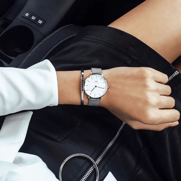 Daniel Wellington Classic Petite Sterling 32mm watch with a white dial and silver stainless steel mesh strap.