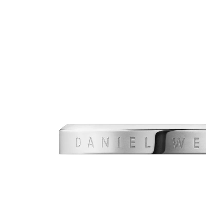 Elegant silver stainless steel Daniel Wellington Classic Ring featuring a minimalist, polished design with engraved branding.