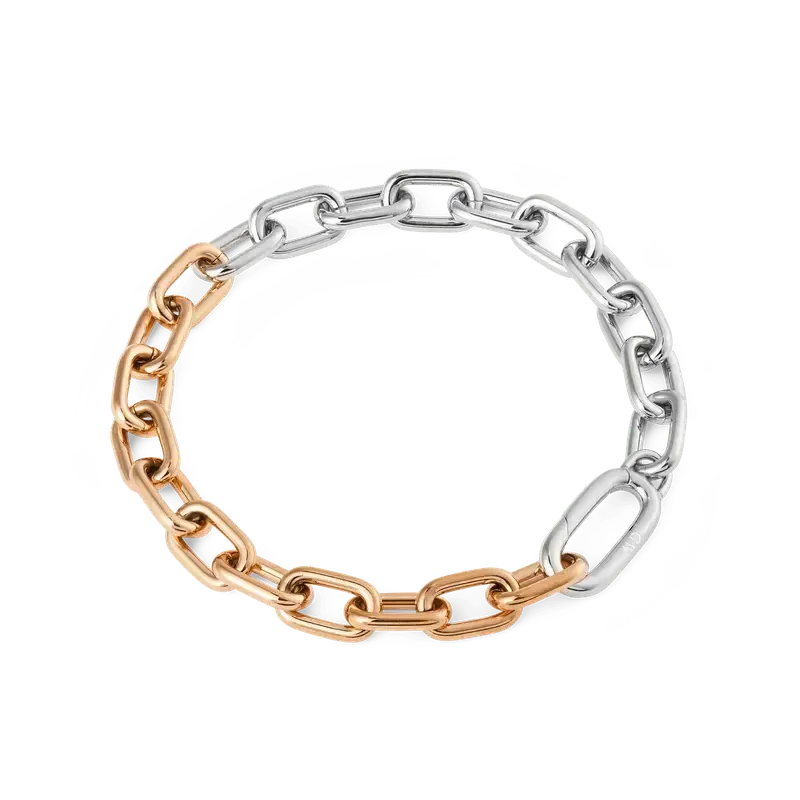Daniel Wellington two-tone stainless steel link bracelet featuring polished silver and rose gold architectural chain links.