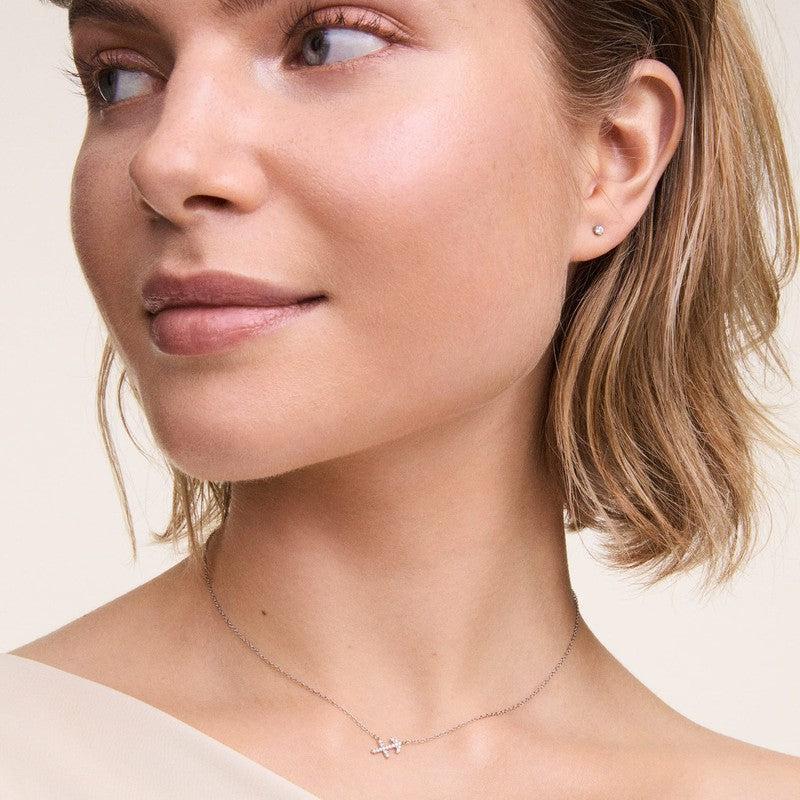 Elegant Daniel Wellington rose gold crystal stud earrings in stainless steel with a delicate claw setting.