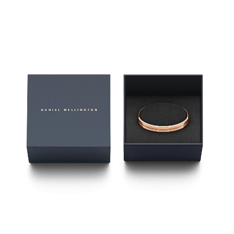 Elegant rose gold plated Daniel Wellington Elan cuff bangle displayed in a premium branded gift box.