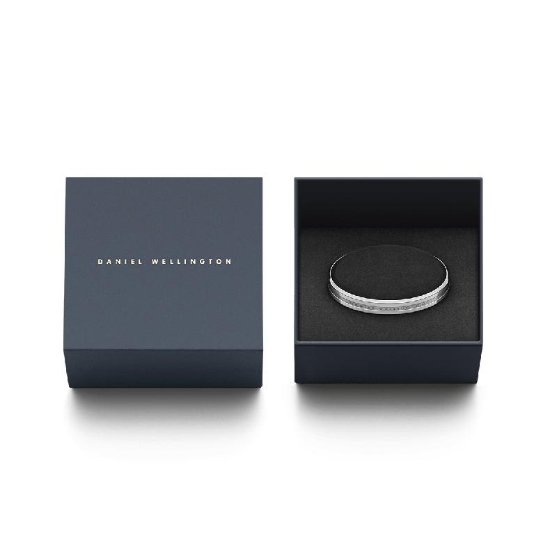 Daniel Wellington Elan silver stainless steel cuff bracelet presented in a signature branded gift box.