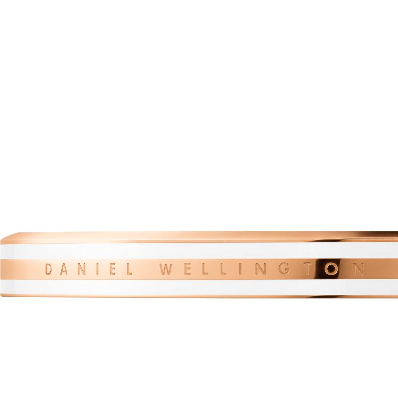 Elegant rose gold and white enamel Daniel Wellington Emalie slim cuff bracelet with engraved logo detail.