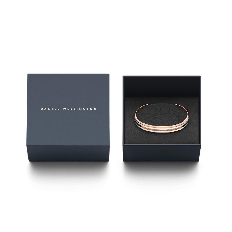 Elegant rose gold Daniel Wellington Emalie Slim cuff bracelet with enamel inlay, presented in a branded gift box.