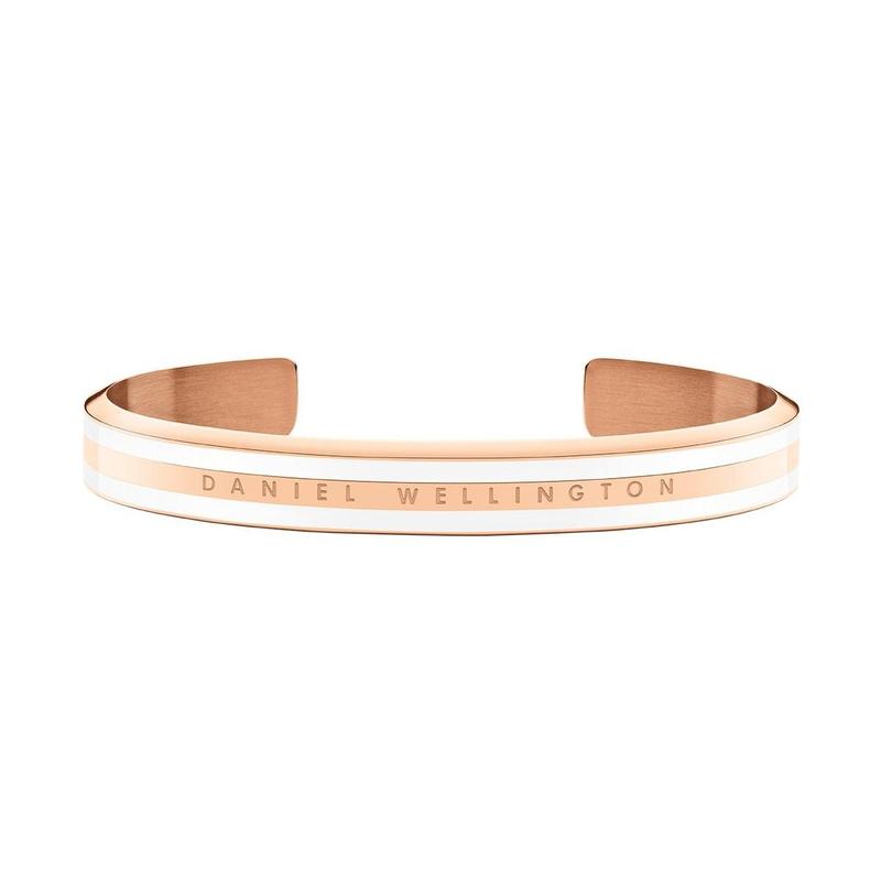 Elegant rose gold Daniel Wellington Emalie Slim cuff bracelet with white enamel inlay and engraved logo detail.