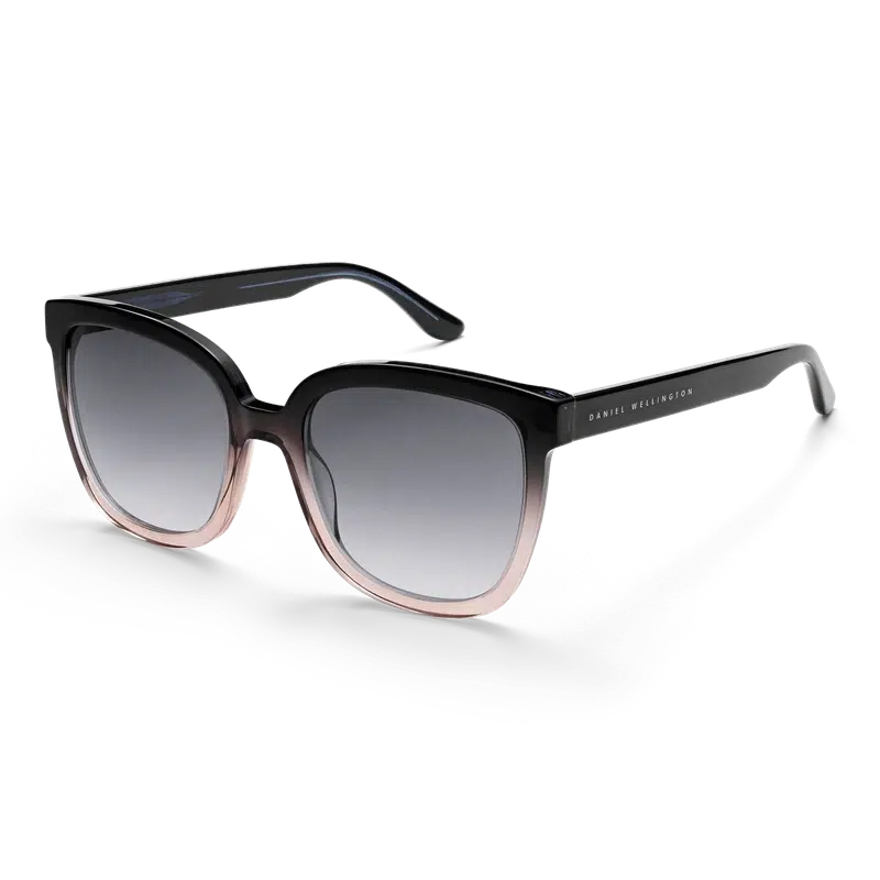 Daniel Wellington Grande oversized sunglasses in blue-to-coral bio-acetate with stylish black gradient lenses.