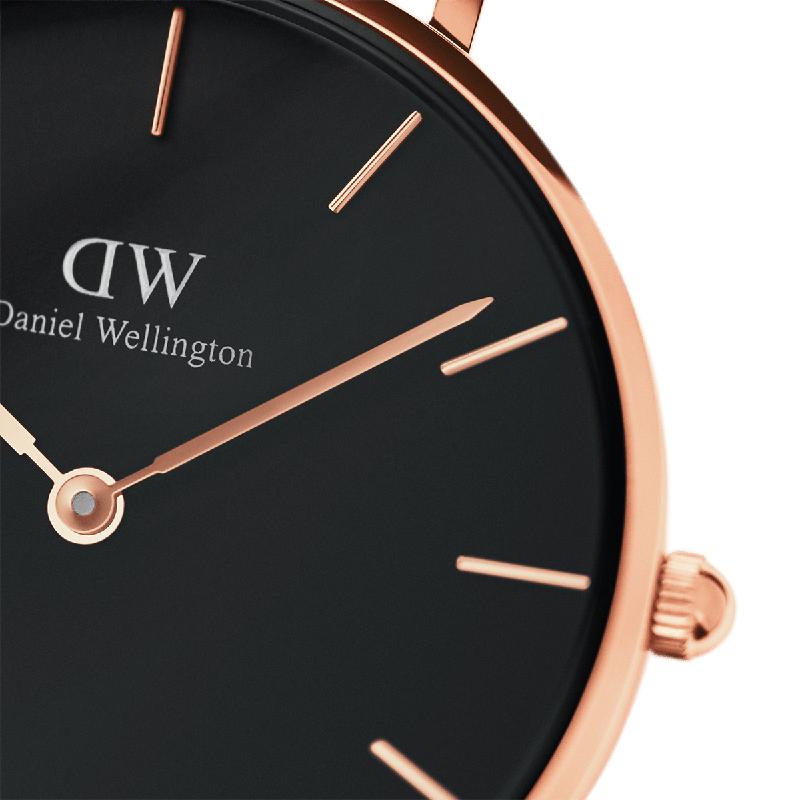 Daniel Wellington Petite Ashfield 32mm watch featuring a sleek black dial and elegant rose gold stainless steel case.