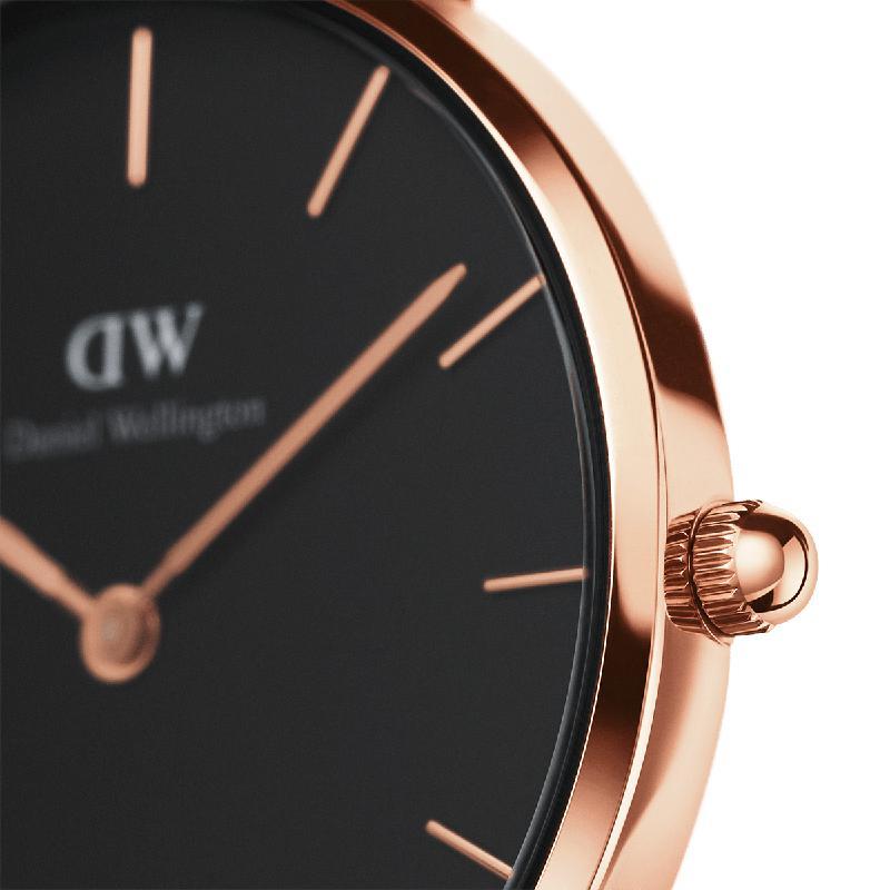 Daniel Wellington Petite Ashfield 32mm watch with a sleek black dial and elegant rose gold stainless steel case.