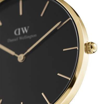 Daniel Wellington Petite Evergold watch featuring a sleek 36mm gold stainless steel case and a minimalist black dial.