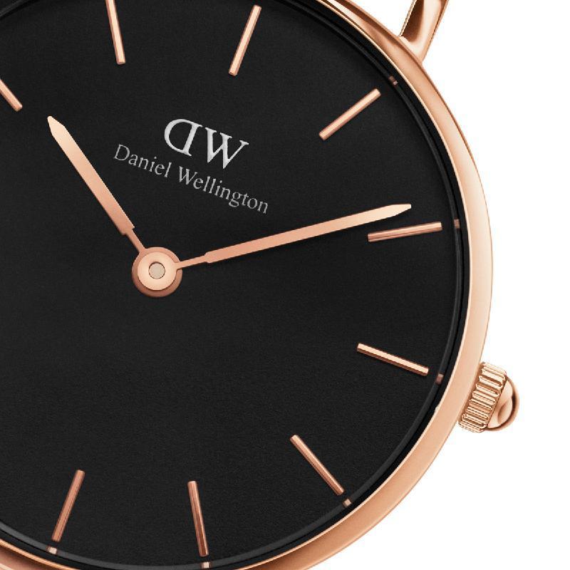 Daniel Wellington Petite Melrose 28mm watch featuring a sleek black dial and elegant rose gold stainless steel case.