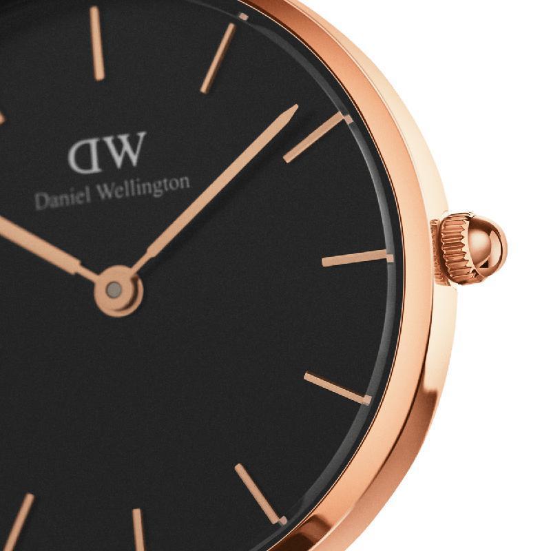 Daniel Wellington Petite Melrose 28mm watch featuring a sleek black dial and elegant rose gold stainless steel case.