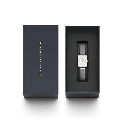 Daniel Wellington Quadro silver watch with white square dial and pressed mesh strap in a branded gift box.