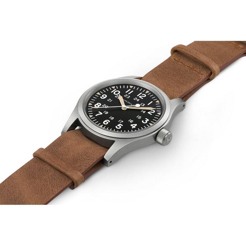 Hamilton Khaki Field Mechanical 38mm watch with a matte stainless steel case, black dial, and brown leather strap.