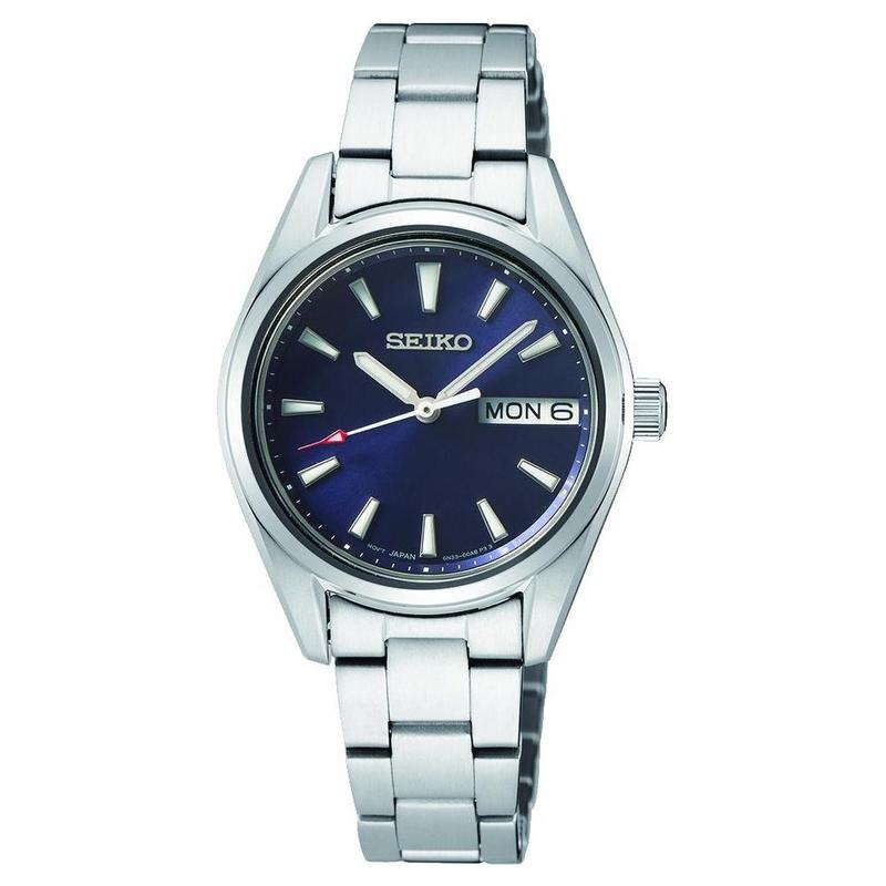 Elegant ladies Seiko stainless steel dress watch featuring a striking blue sunray dial, day-date window, and 100M water resistance.