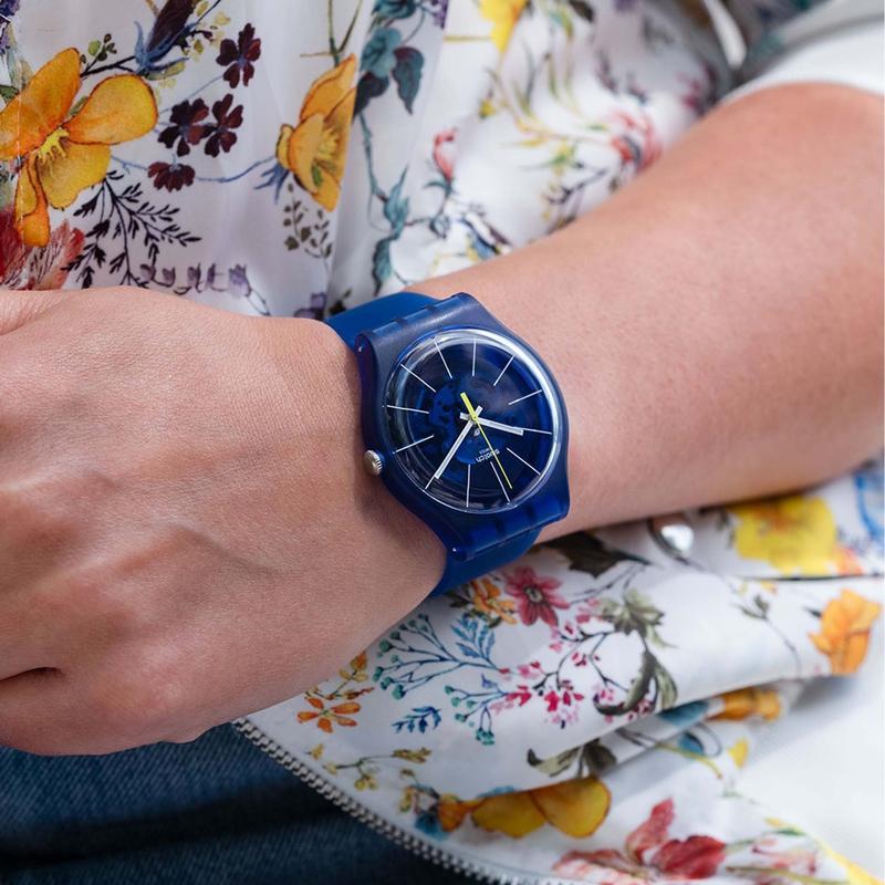 Swatch BLUE SIRUP watch featuring a translucent blue dial, frosted silicone strap, and iconic Swiss quartz movement.