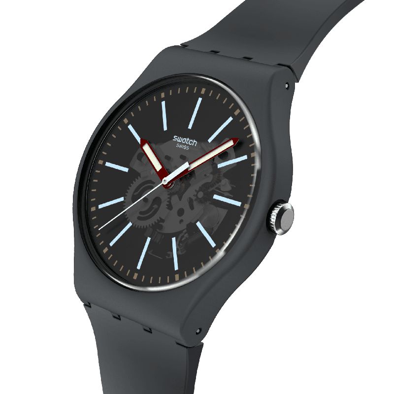 Swatch Coblestone Street watch with a dark gray biosourced case, transparent dial, light blue indexes, and burgundy hands.