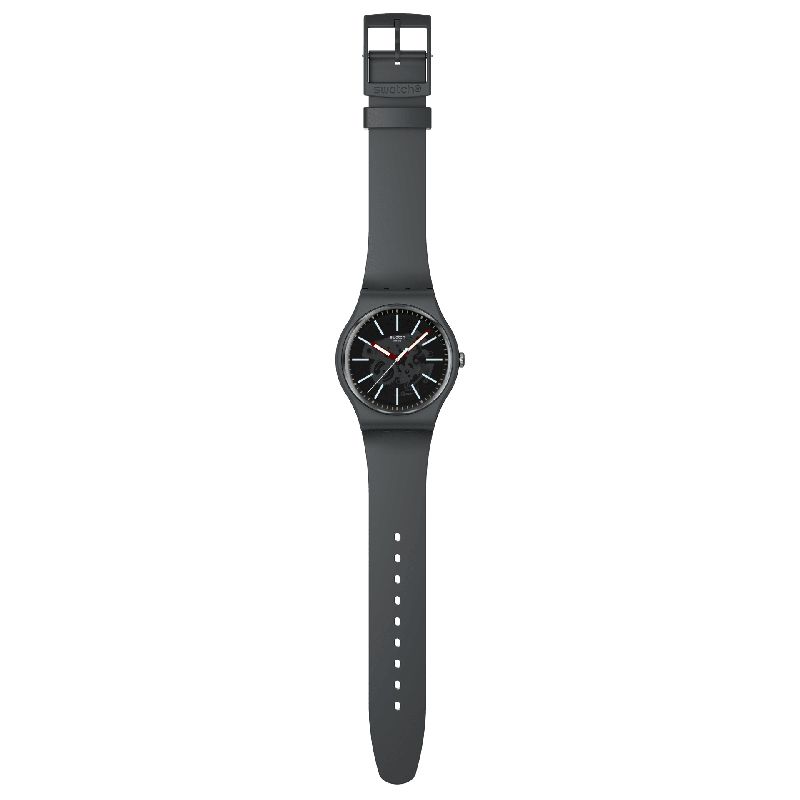 Swatch Coblestone Street watch with a dark gray biosourced case, transparent dial, burgundy hands, and matching gray strap.