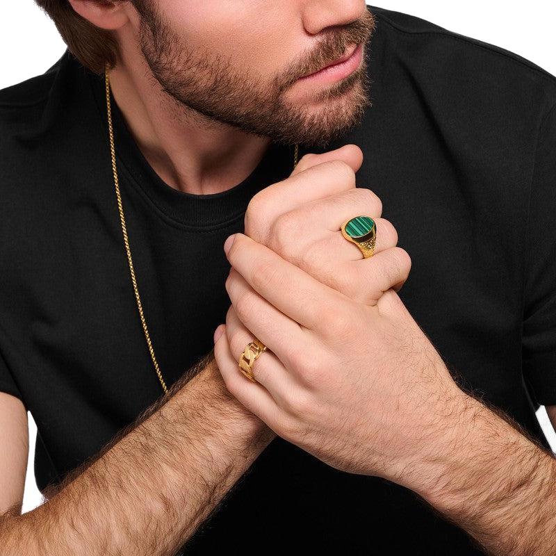 Thomas Sabo gold-plated signet ring featuring a unique green imitation malachite inlay and intricate acanthus engravings.