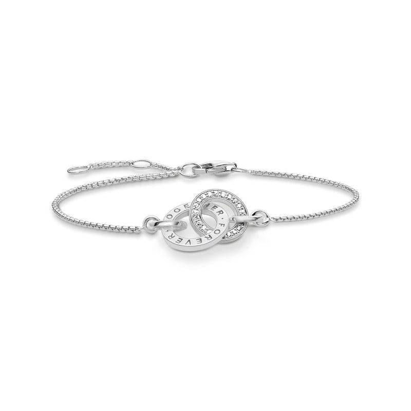Thomas Sabo sterling silver bracelet with interlocking rings, white zirconia pavé, and Forever Together engraving.