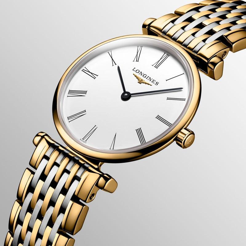 Longines La Grande Classique watch with a 24mm yellow PVD case, white dial, Roman numerals, and two-tone steel bracelet.