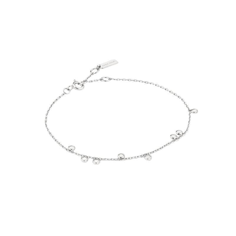 A delicate silver chain anklet with small dangling bead charms and a lobster clasp, displayed on a clean white background.