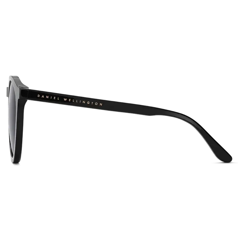 Minimalist black Daniel Wellington Arch sunglasses in sustainable bio-acetate with a sleek, modern side profile.