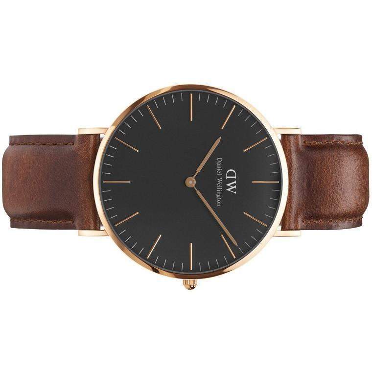 Daniel Wellington 40mm watch with a sleek black dial, rose gold case, and premium brown leather St. Mawes strap.