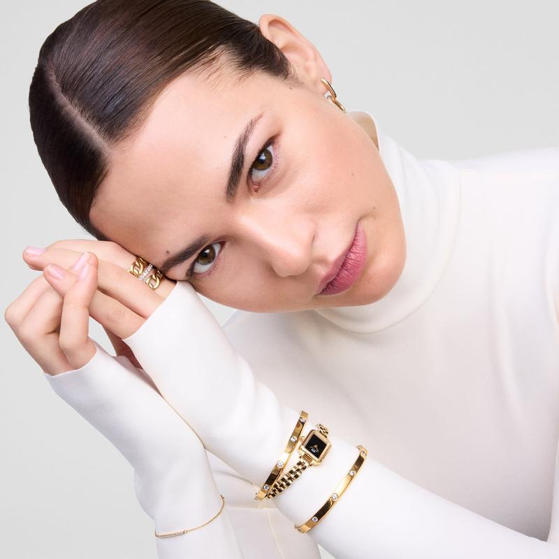 Polished gold Daniel Wellington Classic Lumine cuff bracelet featuring eight sparkling crystals on stainless steel.