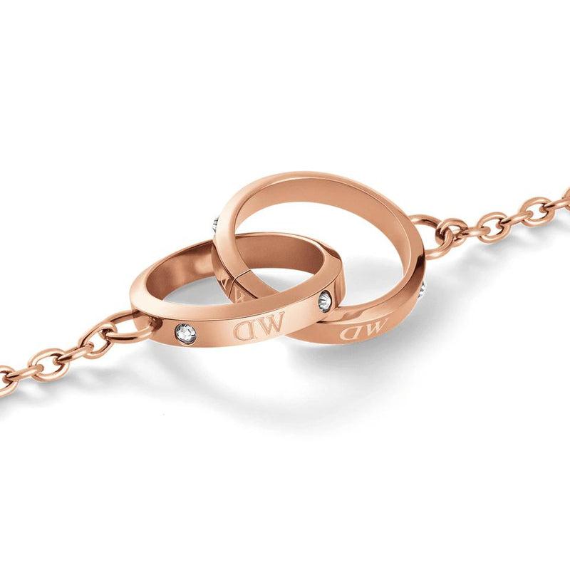 Daniel Wellington Classic Lumine Unity bracelet in rose gold stainless steel with intertwined crystal-studded rings.
