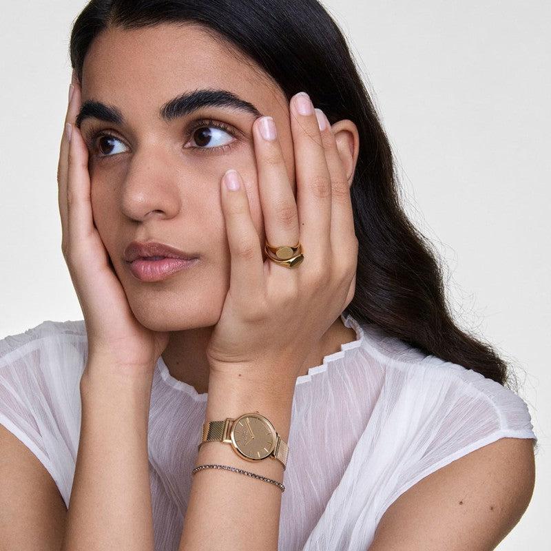 Minimalist gold PVD-plated stainless steel Classic Mini Signet Ring worn on a finger, showcasing an elegant, light-reflecting design.