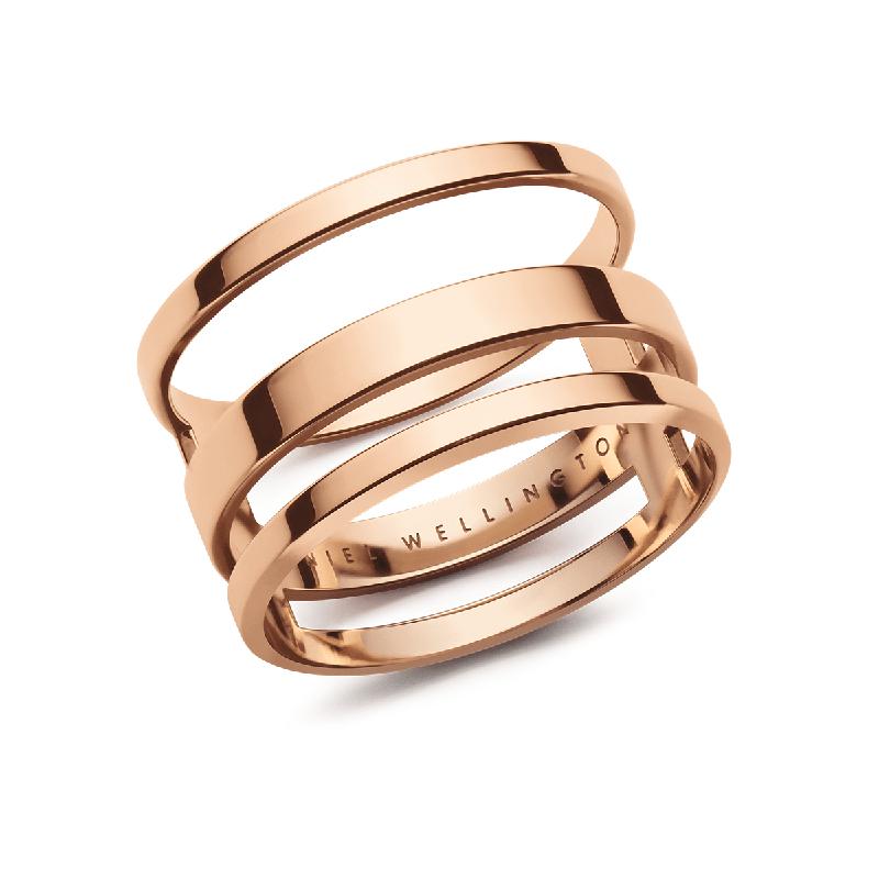 Daniel Wellington Elan Triad ring in polished rose gold-plated stainless steel with a modern three-band layered design.