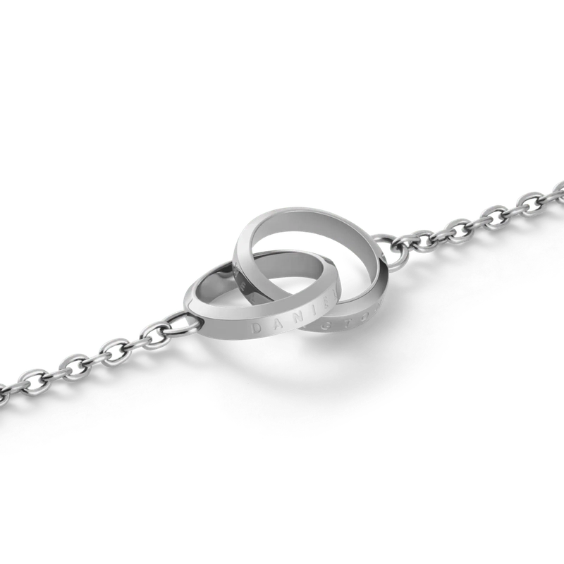 Daniel Wellington Elan Unity bracelet in polished silver stainless steel featuring two interlocking rings on a delicate chain.