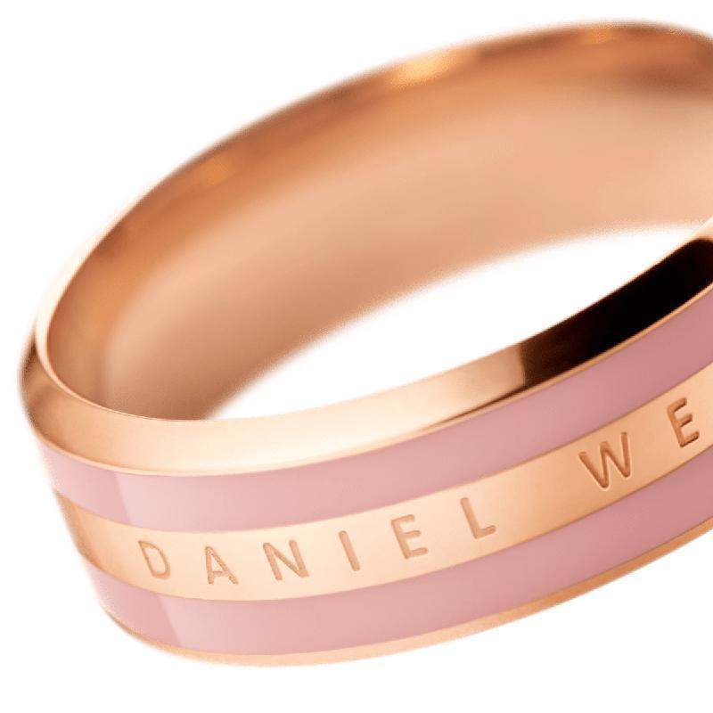 Daniel Wellington Emalie ring in rose gold stainless steel with a dusty pink enamel inlay and engraved logo.