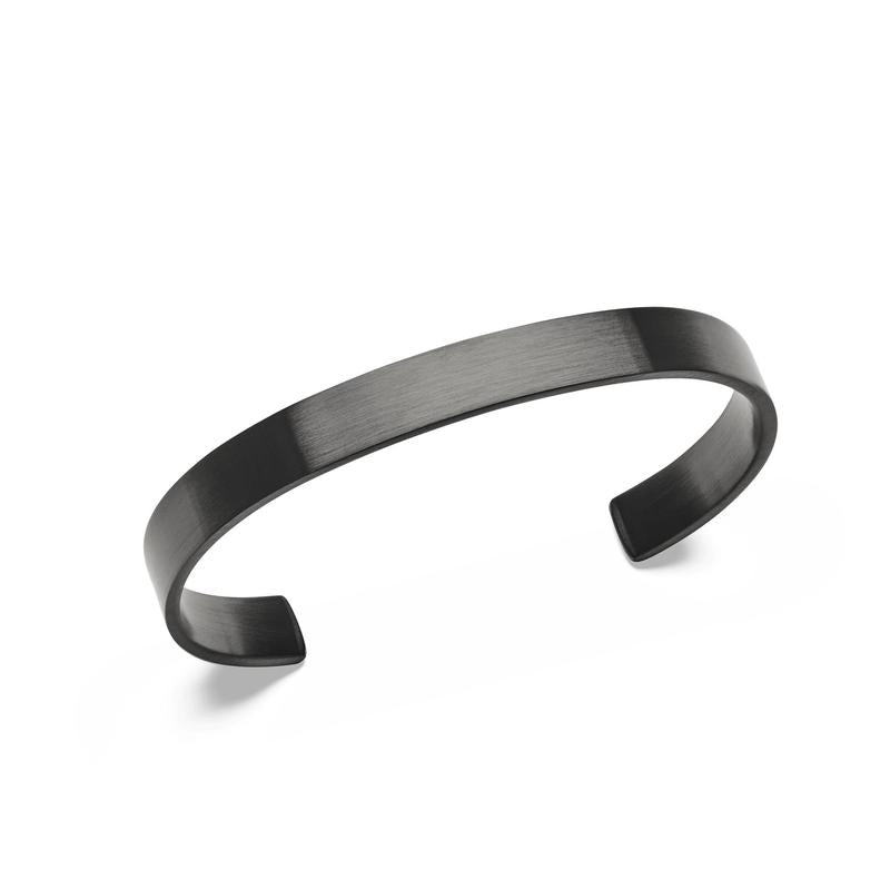 Daniel Wellington Line Cuff in brushed graphite stainless steel with a minimalist, open-design unisex silhouette.