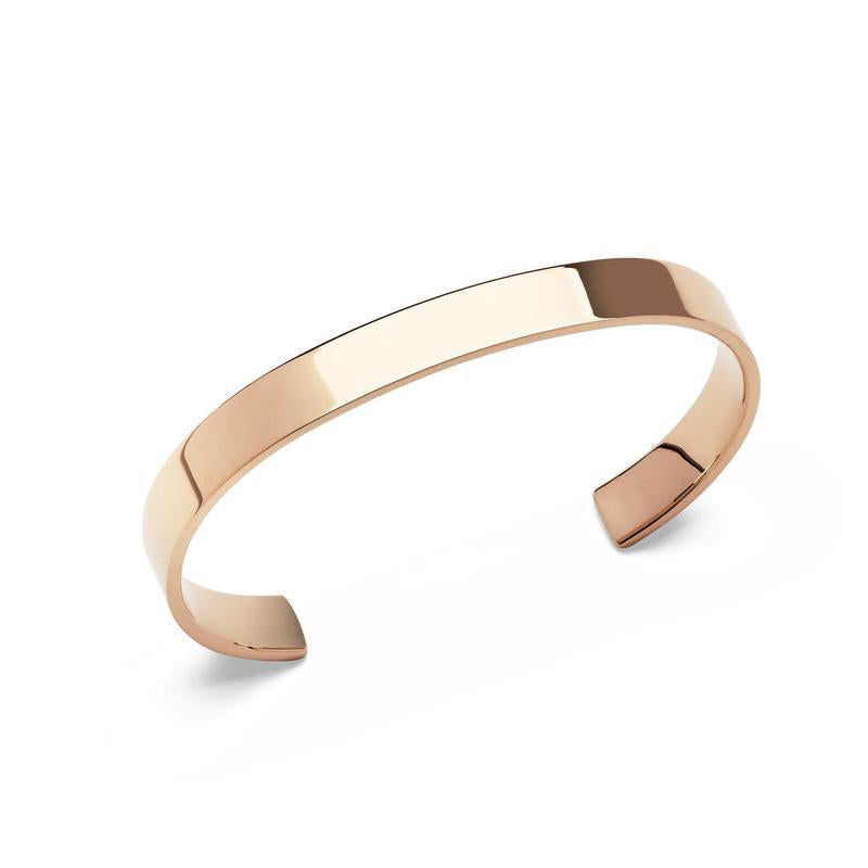 Minimalist Daniel Wellington Line Cuff in polished rose gold stainless steel with a sleek, 7mm mirror-finish design.