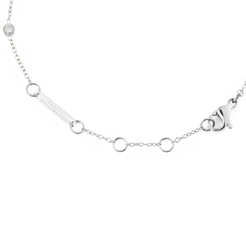 Daniel Wellington silver bracelet featuring a delicate chain, branded logo tag, and secure lobster clasp closure.