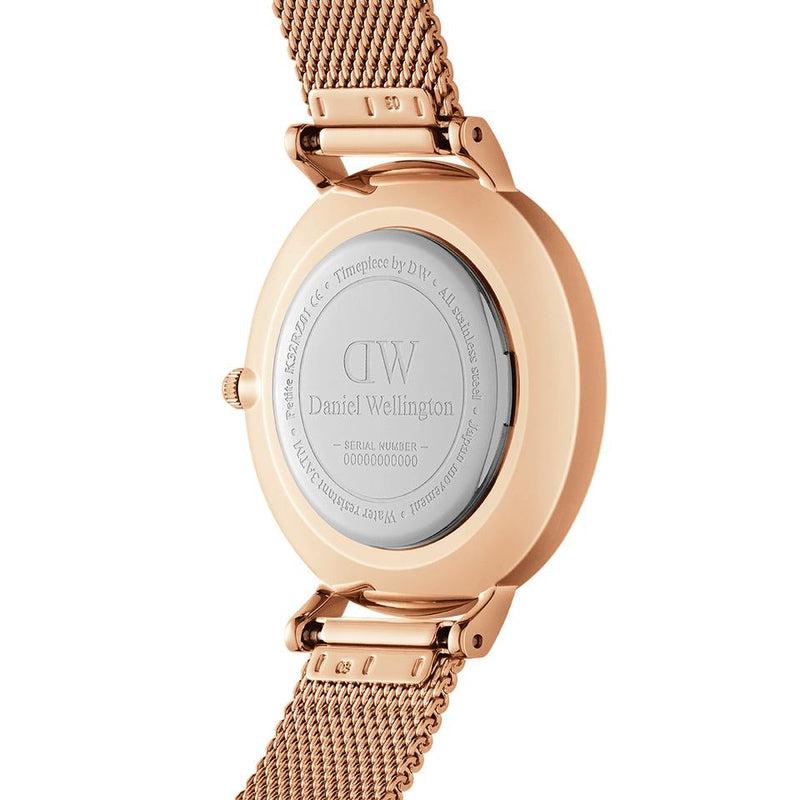Back view of Daniel Wellington Petite 28mm watch featuring a polished rose gold stainless steel case and elegant mesh strap.