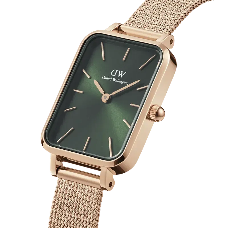 Daniel Wellington Quadro Pressed Melrose watch with emerald green square dial and rose gold mesh strap.