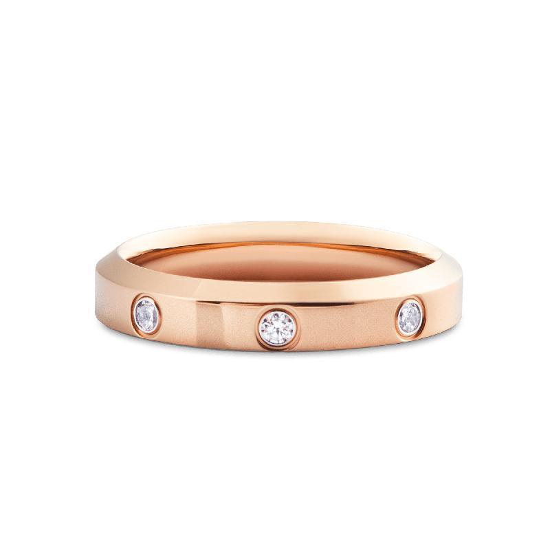 Daniel Wellington 4mm rose gold stainless steel ring featuring sparkling embedded crystals in a minimalist polished band.