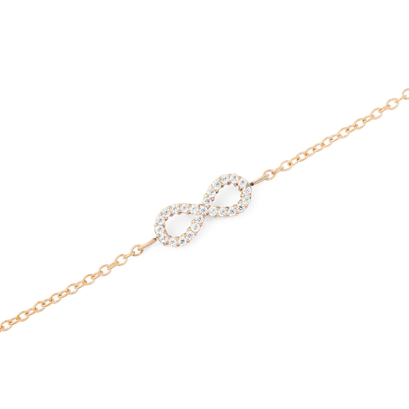 Dainty rose gold infinity bracelet featuring a sparkling crystal-encrusted charm on a delicate, adjustable chain.