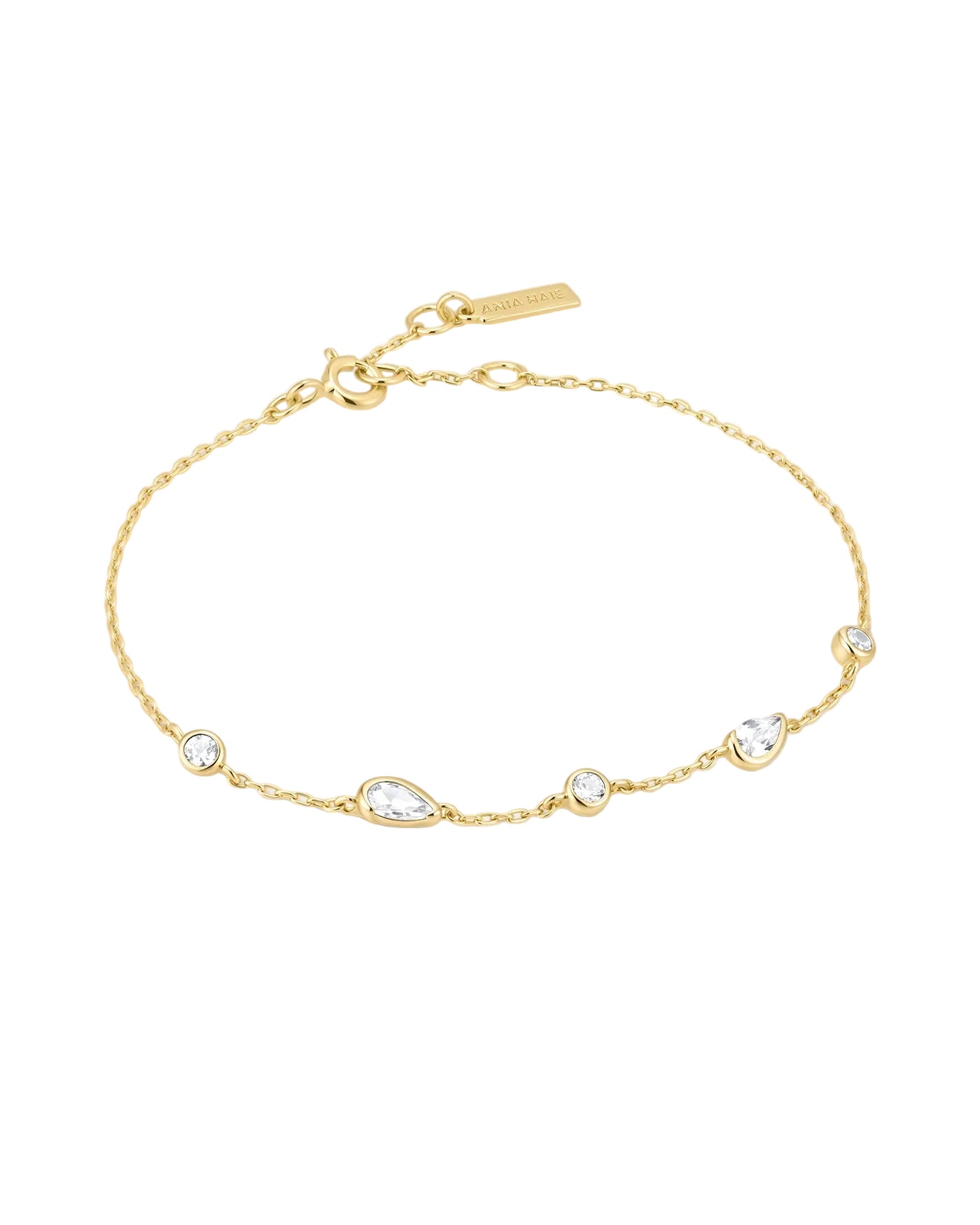 A delicate gold chain bracelet with five clear teardrop and round gemstones, displayed on a clean white background.