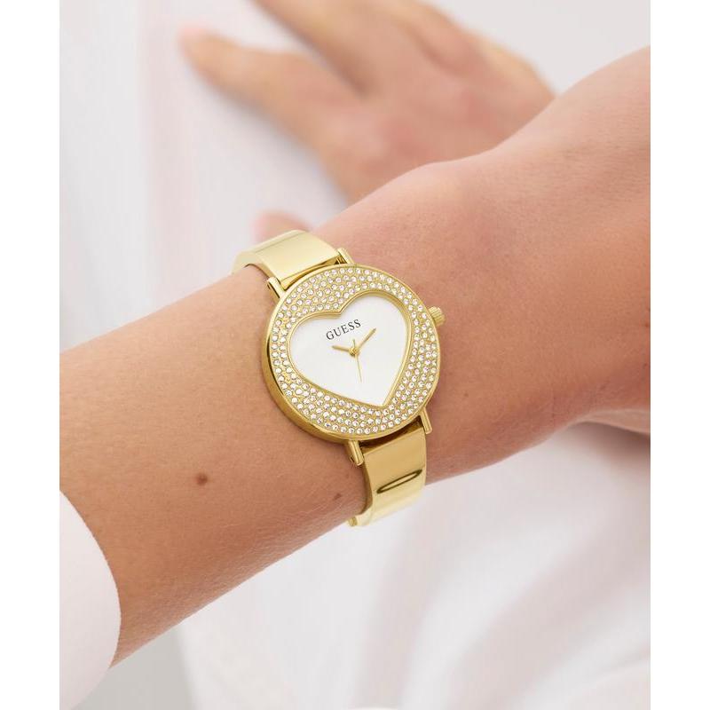 Guess Ladies Gold Tone Analog Watch with Heart‑Shaped Sunray Dial
