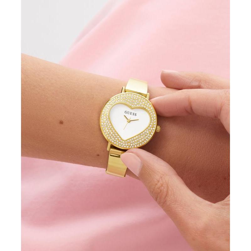 Guess Ladies Gold Tone Analog Watch with Heart‑Shaped Sunray Dial